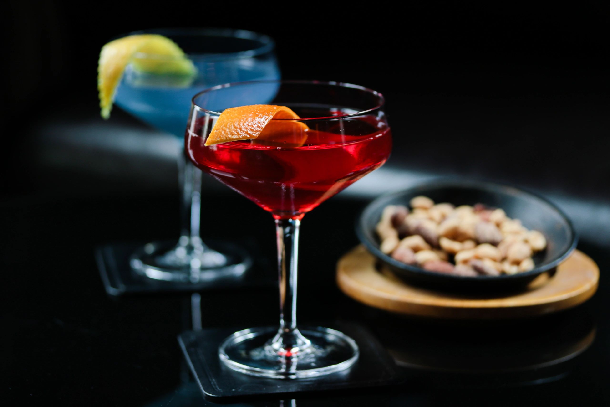 Cocktail photographed at a bar with nuts