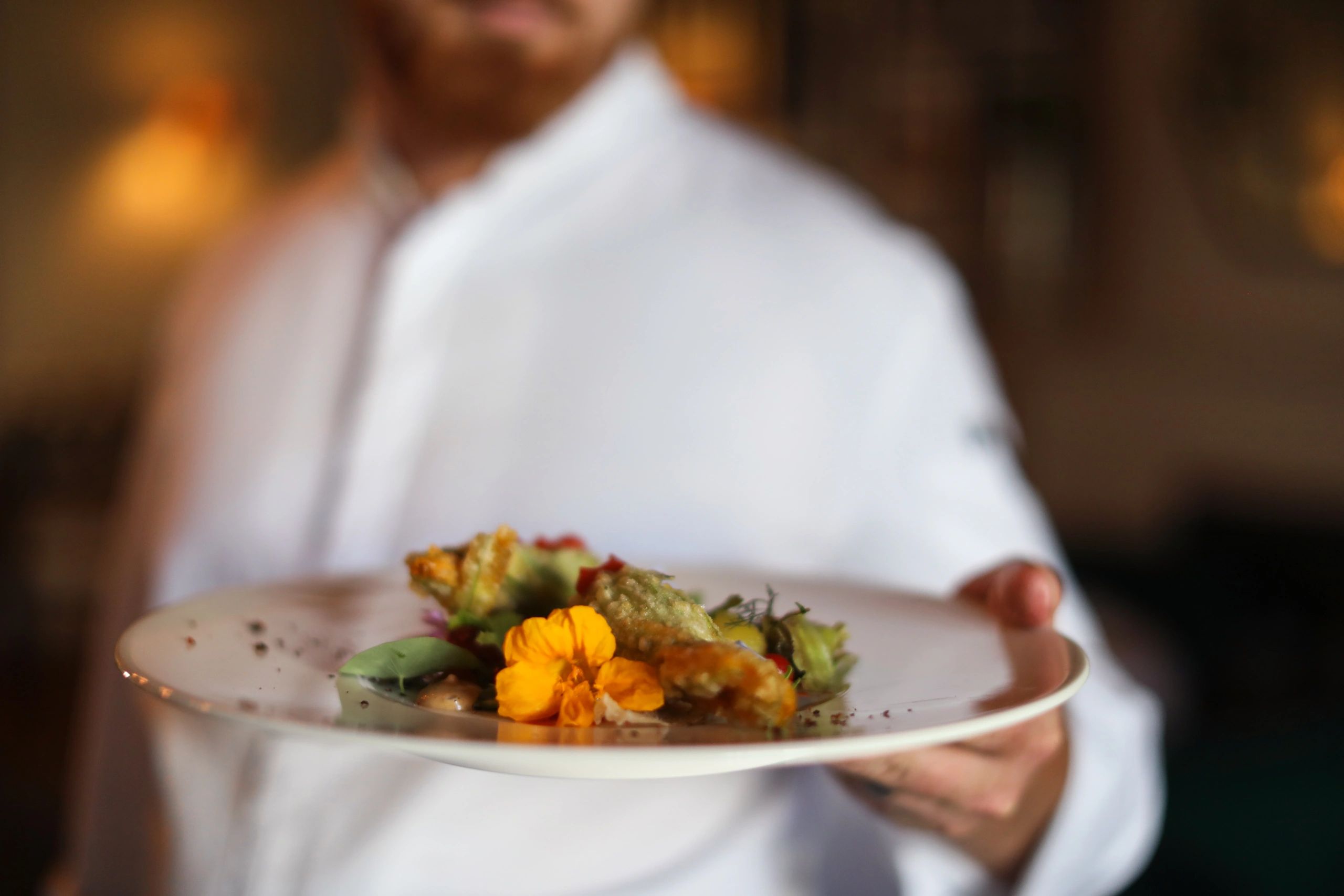 Chef preparing for dinner service in a professional kitchen