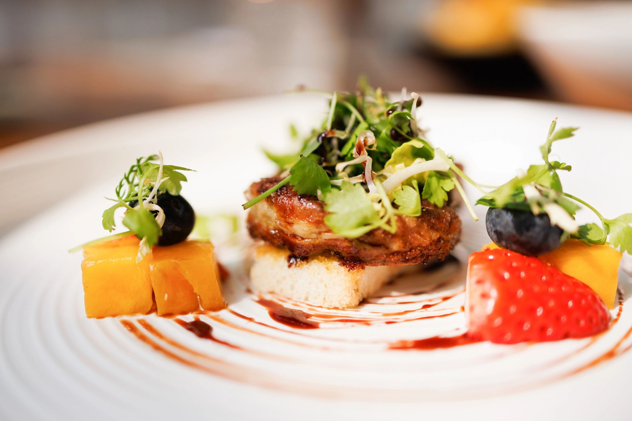 Foie gras with toasted bread and fruit garnish