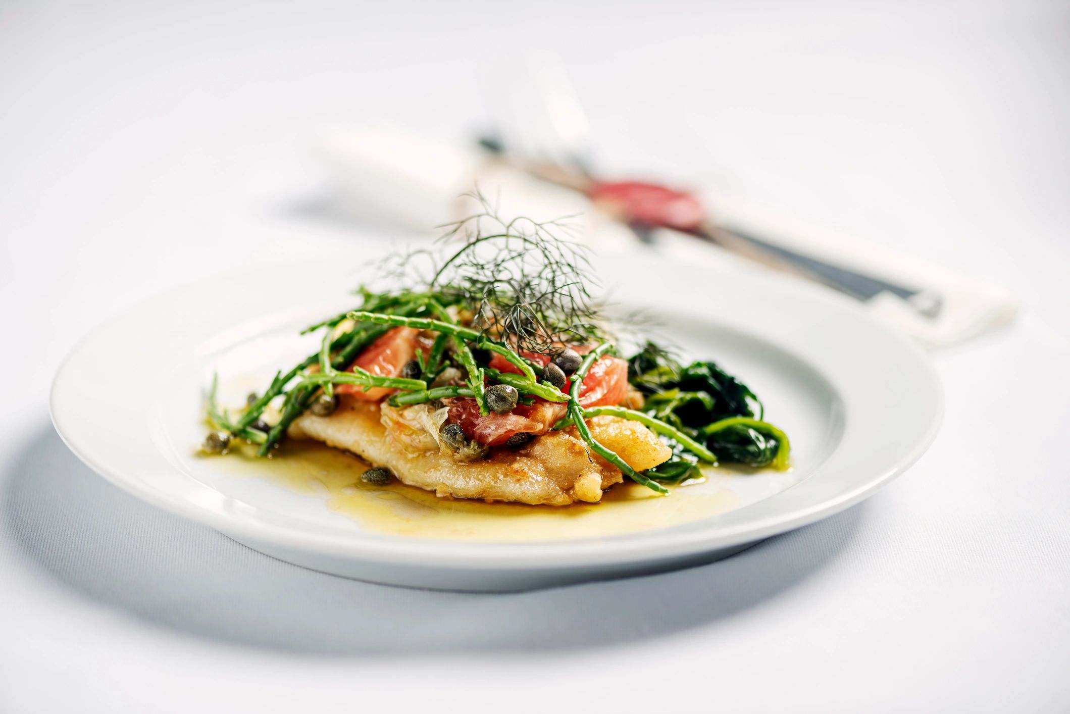 Pan-fried lemon sole in brown butter sauce with capers and herbs